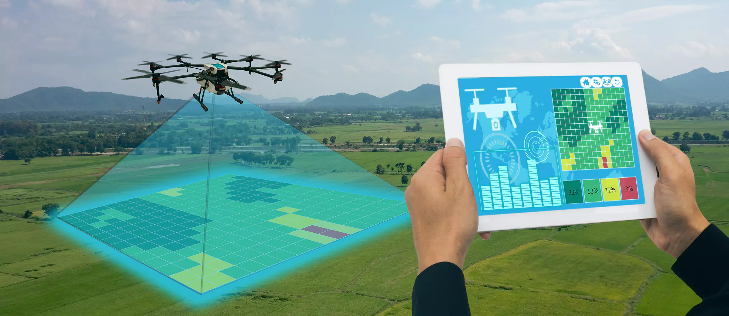 Engineer holding a tablet controlling drone technology on farm land