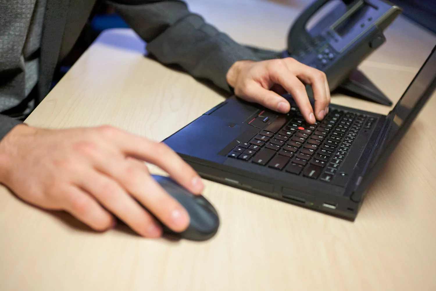 Tech entrepreneur working on black laptop