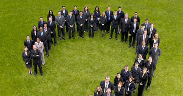 Aerial view of employees standing together on a field